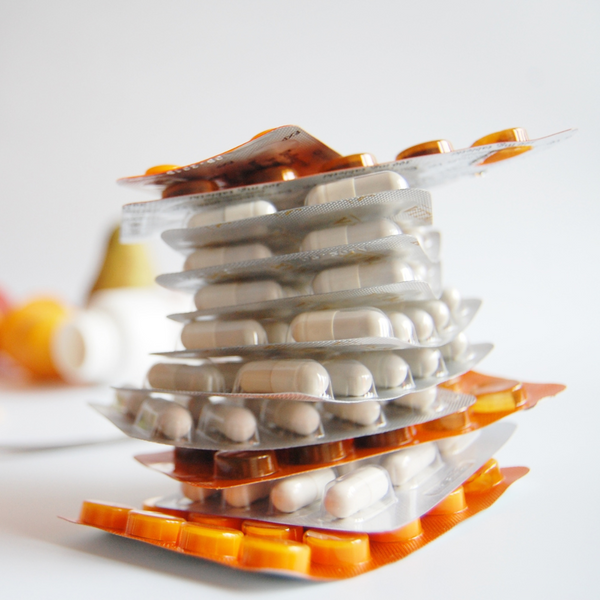 Stack of medication blister packs on a table