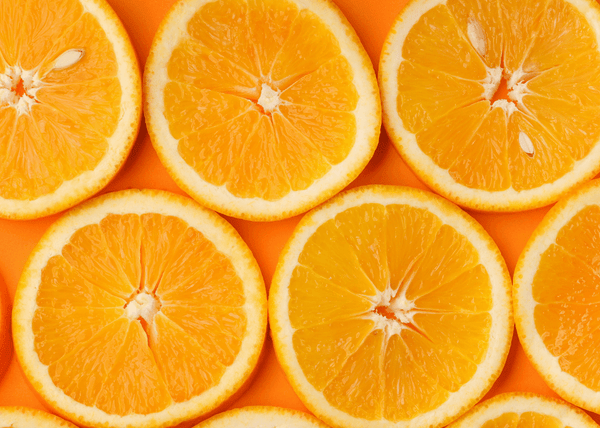 Close-up of sliced oranges arranged in a grid pattern