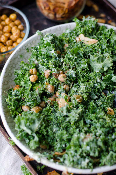 Bowl of kale salad with roasted chickpeas and garlic
