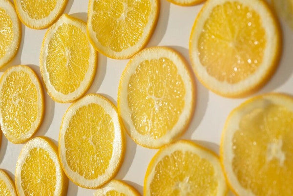 Close-up of overlapping orange slices arranged in rows