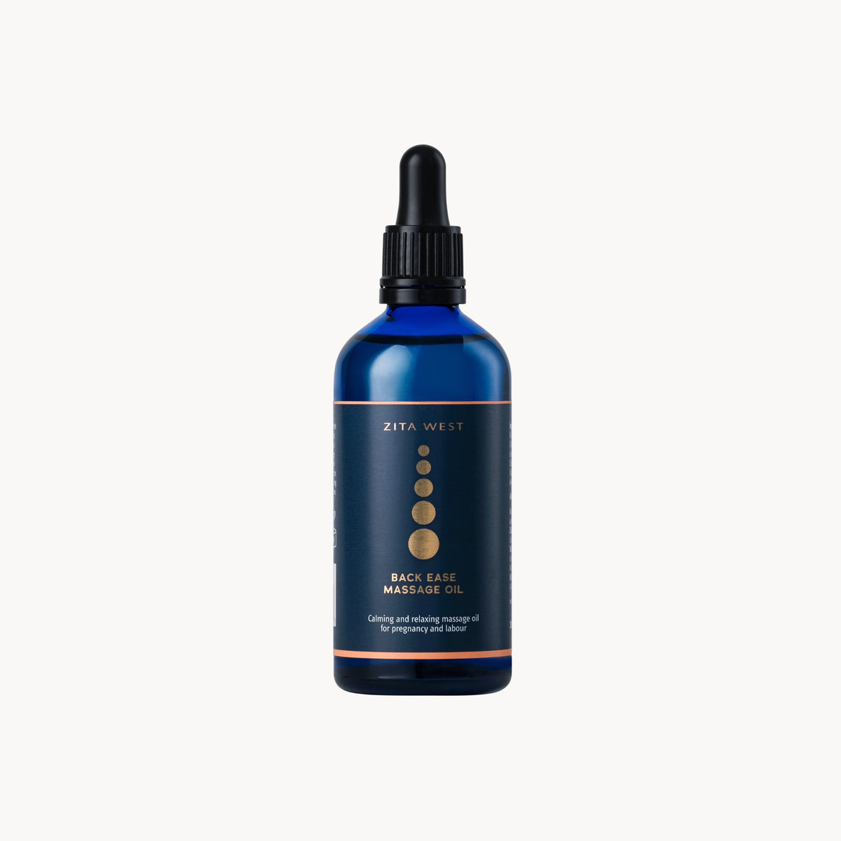 Blue massage oil bottle with black cap on a white background by Zita West