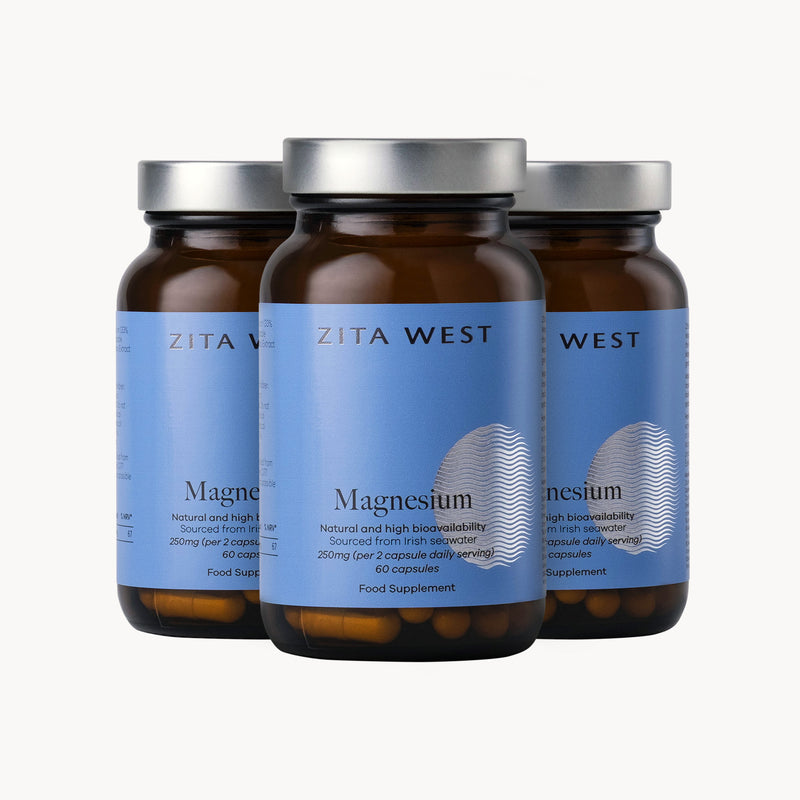 Three bottles of Zita West Magnesium supplements on a white background