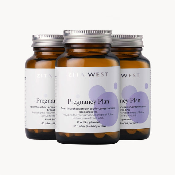 Three bottles of Zita West Pregnancy Plan supplement on a white background