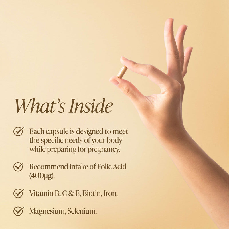 A hand holding a Vitafem capsule with copy showing what is inside