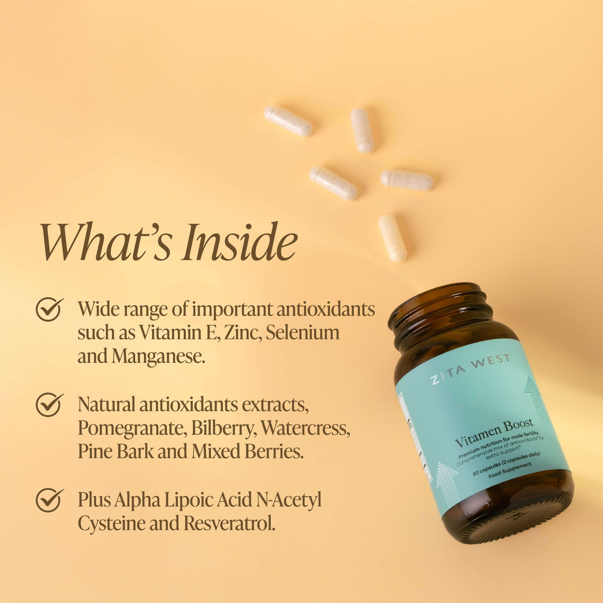 Zita West Vitamen Boost bottle on its side with capsules scattered around it, beside text listing key ingredients