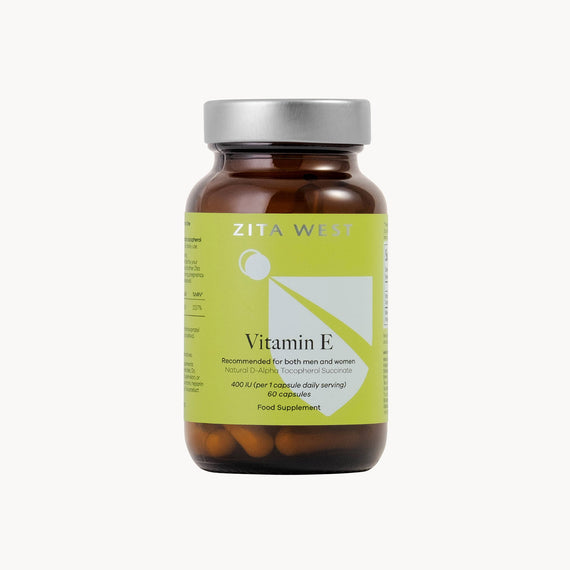 Bottle of Zita West Vitamin E supplements on a white background
