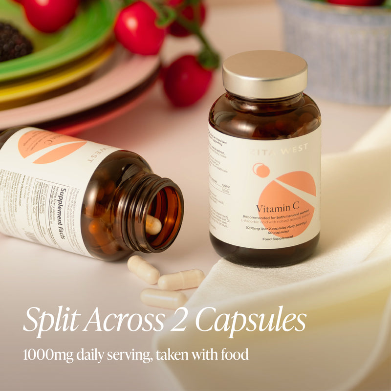 Two bottles of vitamin C supplements on a table with text about daily serving size.