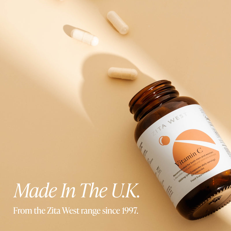 Brown bottle with a label on a beige background, featuring text about 'Made in the U.K.' and 'Zita West' brand.